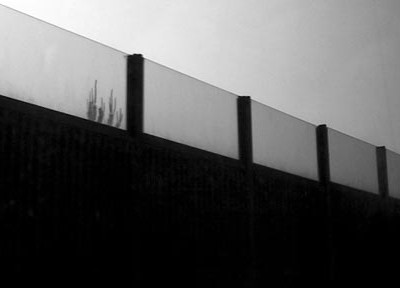 A photograph of a fence to illustrate the flash fiction "Siberia" by LE Butler, published in issue 24 of Neon