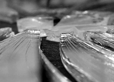 A photograph of broken glass to illustrate the flash fiction "Grief Triptych" by Sara Crowley, published in issue 23 of Neon