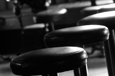 A photograph of a bar stools to illustrate the flash fiction “Sweeten” by Kirsty Logan, published in issue 21 of Neon