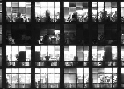 A photograph of office windows to illustrate the hybrid fiction “Spume Law” by Dave Migman, published in issue 22 of Neon