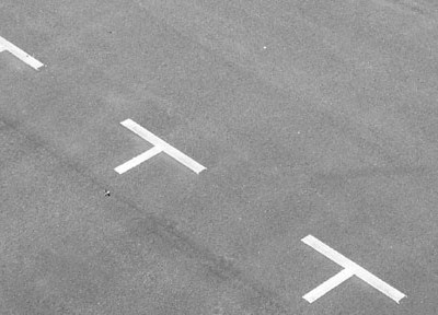 A photograph of a car park to illustrate the short story "Third Party, Fire & Theft" by Dan Powell, published in issue 25 of Neon