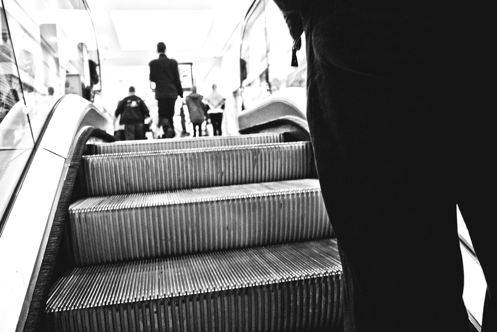 A photograph of an escalator to illustrate the poem "Saturday Night After Work" by Megan Kellerman, published in issue 30 of Neon