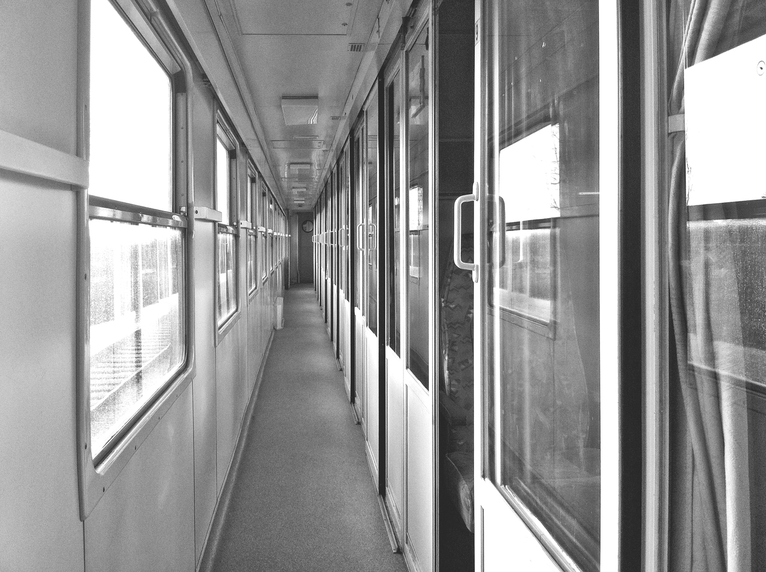 A photograph of a train corridor to illustrate the poem "Timothy Hawkins" by Rebecca L Brown, published in issue 33 of Neon