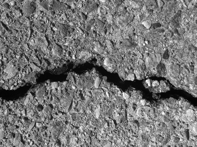 A photograph of a crack to illustrate the poem "Elicit" by Clifford Parody, published in issue 42 of Neon