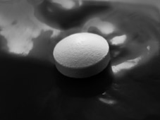 A photograph of a pill to illustrate the flash fiction "The Lotus Eaters" by PK French, published in issue 40 of Neon