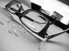 A photograph of glasses to illustrate the poem "He Asks Me to Call Him" by Laura McKee, published in issue 40 of Neon