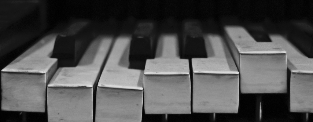 A photograph of piano keys to illustrate the short story “With Compliments” by Annabel Banks, published in issue 48 of Neon